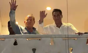 Salman, joined by father Salim Khan, greets cheering crowds outside Galaxy Apts