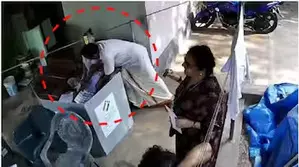 5 poll officials suspended in Kerala for allowing CPI-M leader help elderly woman cast her vote 5 poll officials suspended in Kerala for allowing CPI-M leader help elderly woman cast her vote