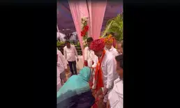 Ashok Gehlots daughter-in-law touches feet of BJP candidate contesting against her husband