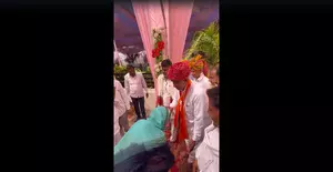 Ashok Gehlots daughter-in-law touches feet of BJP candidate contesting against her husband