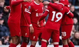 Premier League: Liverpool win at Fulham to go level with leaders Arsenal