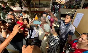 Voting for 14 LS seats underway in Ktaka; Rahul Dravid, FM Nirmala Sitharaman among early voters