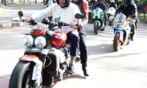 BJP candidate from Chandigarh rides bike to speed up campaign