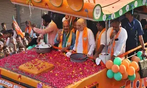 HM Amit Shah holds massive roadshow in Karnatakas Haveri