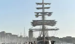 Olympic flame lands at Marseille Old Port amid fiery atmosphere
