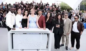 Cannes competition jury headed by Greta Gerwig poses for shutterbugs on the Croisette