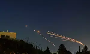 Hezbollah fires dozens of rockets at Israel