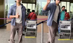 Sidharth Malhotra en route to Delhi to cast his vote, shows victory sign to paparazzi