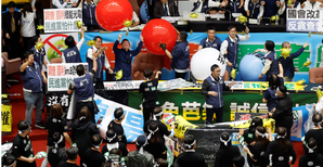 Taiwans opposition-led Parliament amends law to expand power