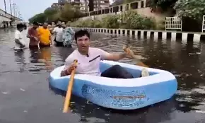 BJP Councillor takes boat ride in waterlogged Patparganj, slams AAP govt