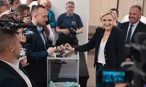 French parliamentary polls close with high turnout, exit poll indicates far-right tops vote share (Lead)