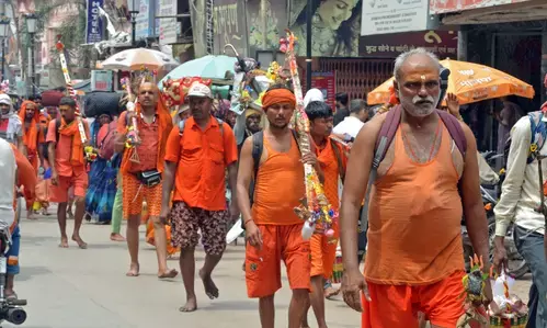 UP govt bans display of arms during Kanwar Yatra