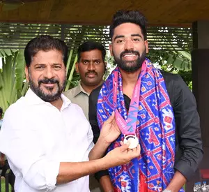 Telangana CM announces house site, govt job for India pacer Siraj (Lead)
