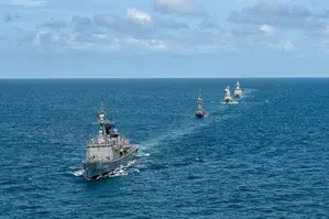 Singapore sends military vessel, helicopter to rescue tankers on fire