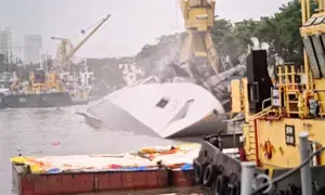 Indian Navy frigate Brahmaputra fully tilts onto one side after onboard fire at Mumbai dockyard (2nd Lead)