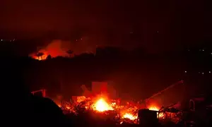 Wildfires rage across US; prompt evacuations, highway shutdown