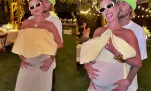 Justin Bieber lovingly holds on to wife Hailey’s blossoming baby bump