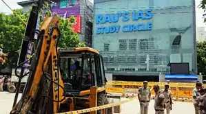 Bulldozer action in Delhi’s Old Rajinder Nagar after 3 drown in flooded basement; JE, AE sacked Bulldozer action in Delhi’s Old Rajinder Nagar after 3 drown in flooded basement; JE, AE sacked
