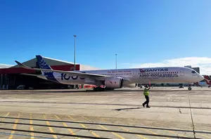 Australias Qantas profits dip to $848 million Australias Qantas profits dip to $848 million