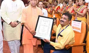 An unconventional tribute: Yogi Adityanath descends from dais to honour injured teacher