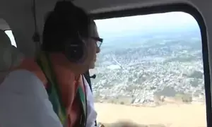 Union Minister Chouhan undertakes aerial survey of flood-hit Khammam, meets farmers