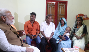 PM Modi interacts with PMAY beneficiaries in Odisha slum