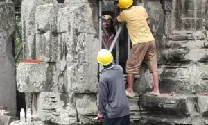 Cambodian experts continue to restore laterite wall of Angkor Thom temple in Angkor park