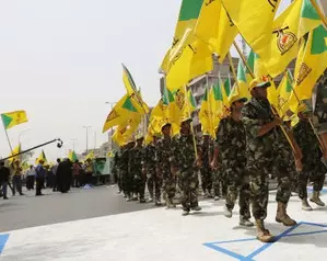 Iraqi Shiite militia threatens to attack US forces if assaulted by Israel Iraqi Shiite militia threatens to attack US forces if assaulted by Israel