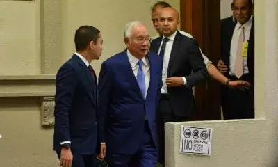 Former Malaysian PM ordered to enter his defence in money laundering case