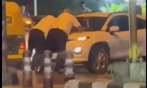 Two traffic cops hang on to car bonnet to stop rash driver near IIT-Delhi