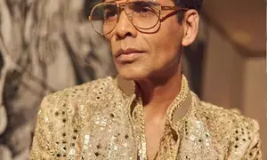 Karan Johar says learn how to be happy alone