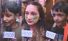 Children give hand-made painting to PM Modi at Japanese park rally