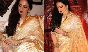 Rekha exudes grace in hand woven gold tissue stripe saree