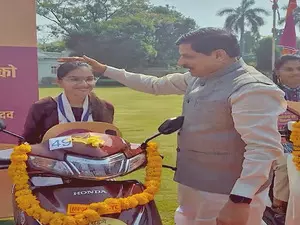 Madhya Pradesh CM distributes e-scooties to meritorious students (Ld)