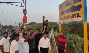 TN: DMK workers blacken Hindi letters on Sankarankoil railway station name board TN: DMK workers blacken Hindi letters on Sankarankoil railway station name board