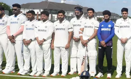 Indian players wear black armbands and observe a minute of silence to honor plane crash victims ahead of warm-up match
