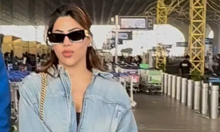 Nikki Tamboli Turns Airport Into a Fashion Runway With Luxe Blue-Toned Look