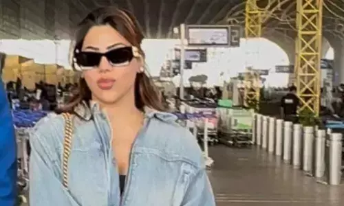 Nikki Tamboli Turns Airport Into a Fashion Runway With Luxe Blue-Toned Look