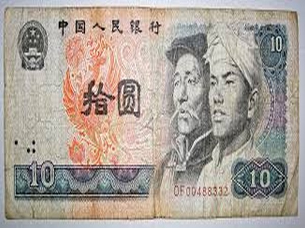 Chinas currency hits 18-month low against USD