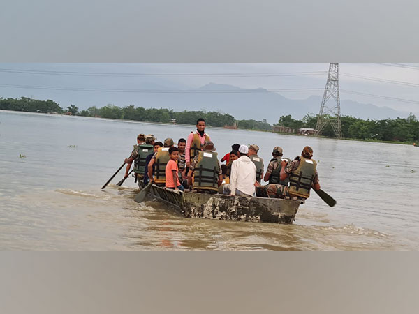 Parents use boats to bring children to primary school surrounded by water in Assams Dhemaji