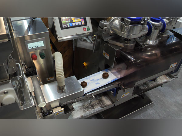 Automatic machines prepare traditional sweet dish Wagashi in Japan