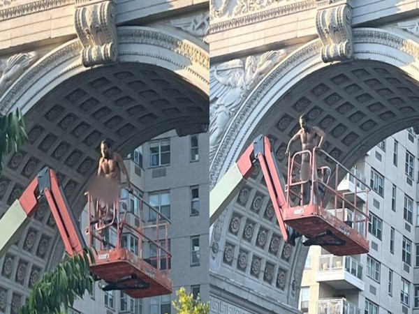Man climbs boom lift, goes full monty and asks spectators, "Are you entertained?"