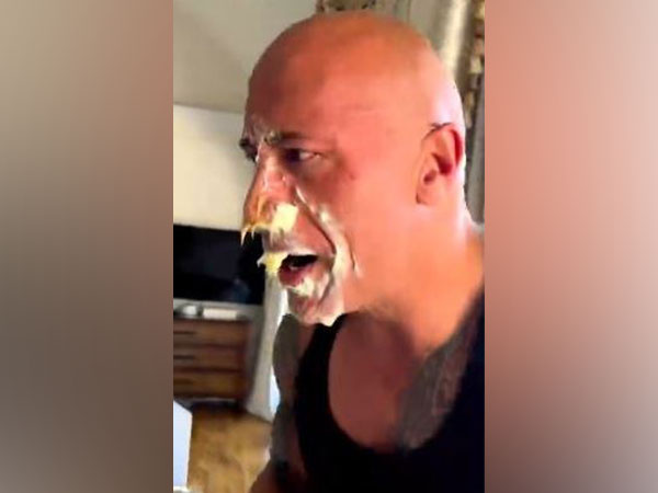 Dwayne Johnson gets a peanut butter slam from his daughter
